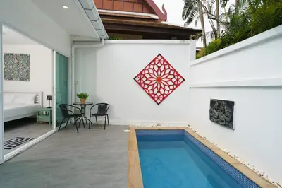 a house with a swimming pool in a yard at Montaplan Villa by G Estate in Rawai Beach
