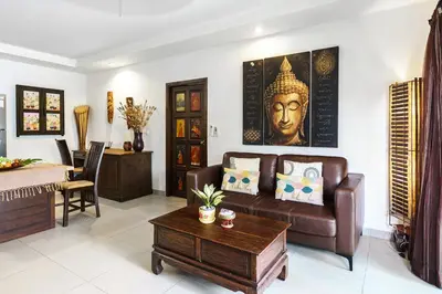 a living room with a couch and a table at Meursault Villa by G Estate in Rawai Beach