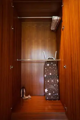 a closet with a bag hanging on a wooden wall at Montrachet Villa by G Estate in Rawai Beach