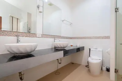 a bathroom with a sink and a toilet at Kamala Beach 3-bedroom villa near Fantasea with high-speed Wi-Fi and private pool in Kamala Beach