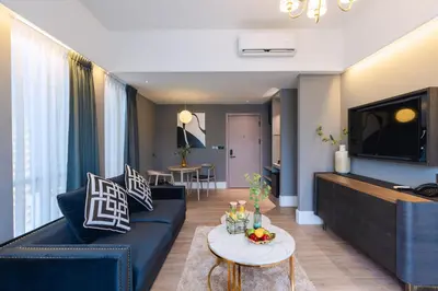 a living room with a couch and a table at Bandalo Boutique Hotel - Patong Beach Road in Patong Beach