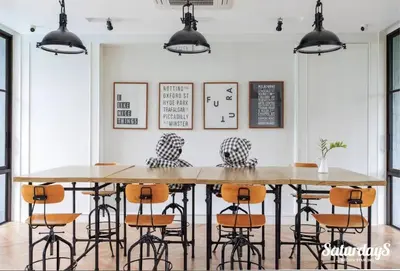 a kitchen with a large wooden table and chairs at Saturays condo One Bedroom Suite 178 in Ban Saiyuan (1)