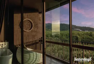 a room with a balcony with a view of the mountains at Saturays condo One Bedroom Suite 178 in Ban Saiyuan (1)