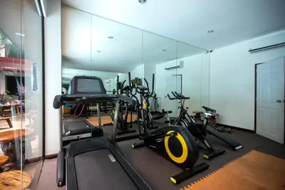 a gym with a bunch of exercise bikes in it at 1bdr apartment NaiHarn Beach condo by Capital Pro in Phuket Town