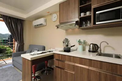 a kitchen with a sink and a counter top at 1bdr apartment NaiHarn Beach condo by Capital Pro in Phuket Town
