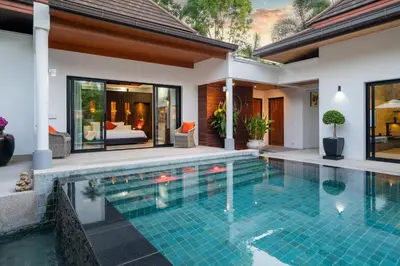 a swimming pool in the backyard of a villa at The Thara Villa Surin Beach in Surin Beach