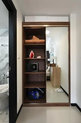 a bathroom with a mirror in a room at 1bdr Apartment Naiharn Beach Condo by CapitalPro in Phuket Town