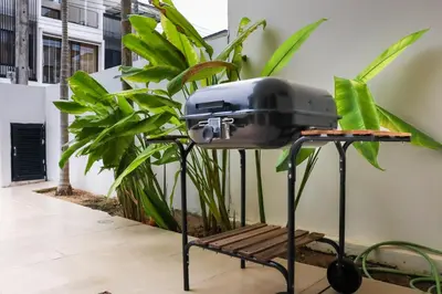 a toaster sitting on a table next to some plants at Welcoming 3bdr Townhouse Laguna Park in Ban Phru Champa