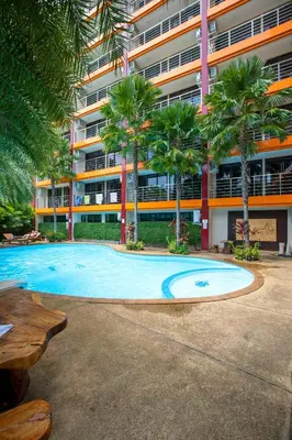 an empty swimming pool in front of a building at 1bdr Spacious Studio near NaiHarn Beach by Capital Pro in Phuket Town