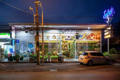 a car parked in front of a store at night at 1bdr Apartment Relife Naiharn by Capital Pro in Phuket Town