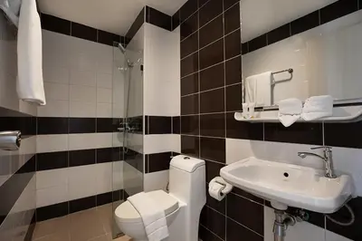 a bathroom with a toilet and a sink at iCheck inn Chill Patong in Patong Beach