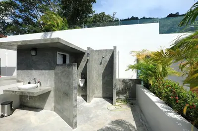 a concrete bathroom with a sink and a sink at 1bdr Apartment on the Kata Beach SPL-101 by Capital Pro in Phuket Town