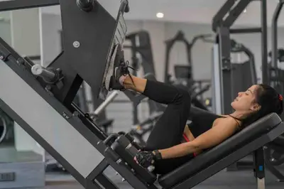 a woman laying on a lift in a gym at Kamala Beach P53 Exclusive Junior Suite in Kamala Beach