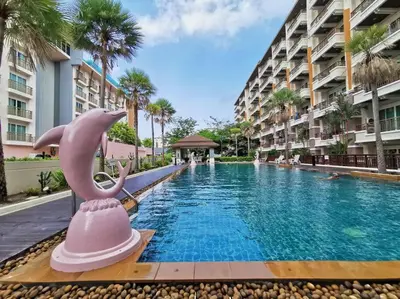 a dolphin pool at a resort with a hotel at Best Location Patong Near Jungceylon + Pool Access in Patong Beach