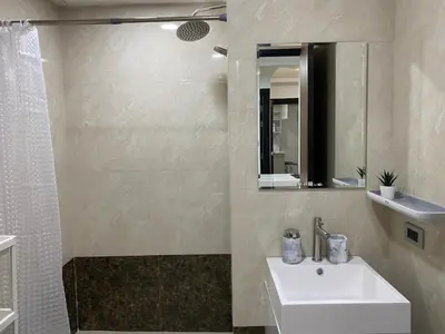a bathroom with a sink and a mirror at New apartment Rawai Beach 310 by Capital Pro in Phuket Town