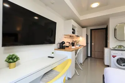 a white kitchen with a sink and a washing machine at New apartment Rawai Beach 218 by Capital Pro in Phuket Town