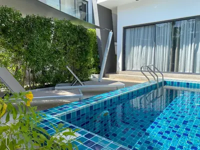 a swimming pool with blue tiles on the side of a building at 2bdr pool villa in Rawai by Capital Pro SUM-20-144 in Phuket Town