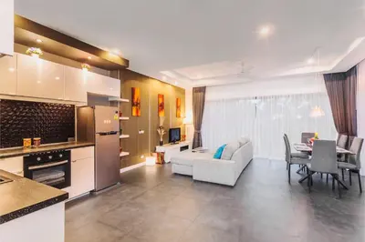 a kitchen and living room with a couch and a table at 2bdr pool villa in Rawai by Capital Pro SUM-20-144 in Phuket Town