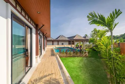 an exterior view of a house with a swimming pool at 3bdr VIP Villa Rawai with private pool in Phuket Town