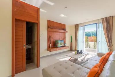 a living room with a couch and a table at 3bdr VIP Villa Rawai with private pool in Phuket Town