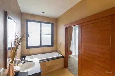a bathroom with a bath tub and a window at 3bdr VIP Villa Rawai with private pool in Phuket Town