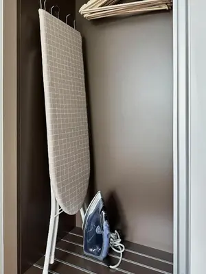 a pair of shoes sitting on the floor in a closet at Title V Poolside Pool View Gym Hammam in Rawai Beach