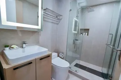 a bathroom with a sink and a shower and a toilet at A401-Silk Condo Aonang, Sea view - 5 mins to beach in Krabi town