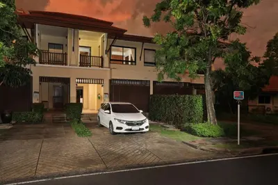 a white car parked in front of a house at 2bdr Townhouse in Laguna Village by Capital Pro in Phuket Town