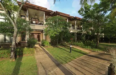 a building with a walkway in front of it at 2bdr Townhouse in Laguna Village by Capital Pro in Phuket Town
