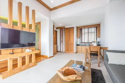 a living room with a large flat screen tv at Aonang Suite Pool Villa in Ao Nang Beach