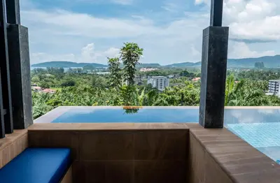 a swimming pool with a view of the city at Aonang Suite Pool Villa in Ao Nang Beach