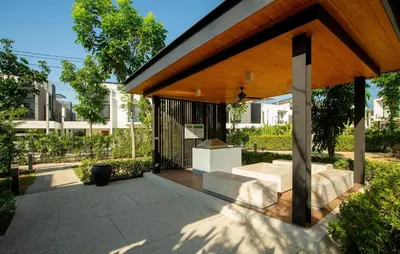 a pavilion with a table and benches on a patio at 2 bdr Townhouse in Laguna Park by CapitalPro in Phuket Town