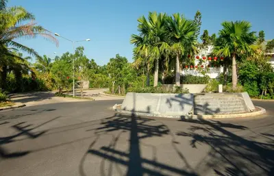 a shadow of a shadow of a street with palm trees at 2 bdr Townhouse in Laguna Park by CapitalPro in Phuket Town