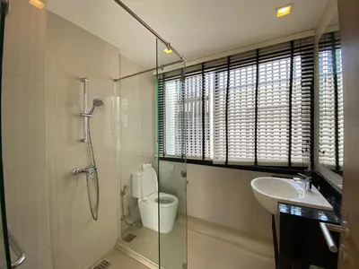 a bathroom with a shower and a toilet and a sink at 2 bdr Townhouse in Laguna Park by CapitalPro in Phuket Town