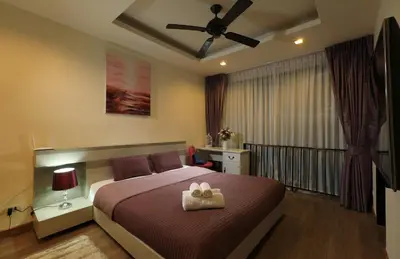 a bedroom with a bed with a towel on it at 3bdr Townhouse Laguna Park by CapitalPro 131 in Phuket Town