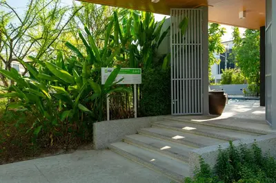 a set of stairs leading to a house with plants at 3bdr Townhouse Laguna Park by CapitalPro 131 in Phuket Town