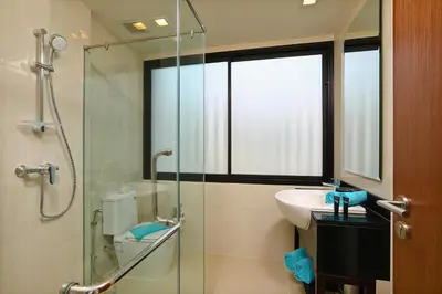 a bathroom with a glass shower and a sink at 3bdr Townhouse Laguna Park Bangtao Beach by CapitalPro in Phuket Town