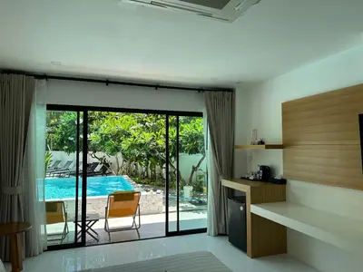 a kitchen with a view of a swimming pool at Ton Sai Tropical Phi Phi Island in Phi Phi Don