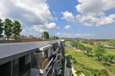 an apartment building with a view of a golf course at Bangtao beach Cozy apartments by Capitalpro in Phuket Town