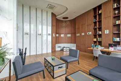 a room with two chairs and a table and a desk at 1 bdr Sea view Apartment in Mida Surin Beach by Capital Pro in Phuket Town