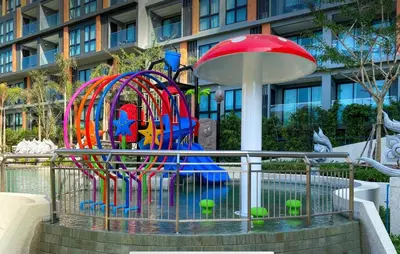 a playground in front of a building at 2 bdr Apartment in Mida Grande Surin Beach by CapitalPro in Phuket Town