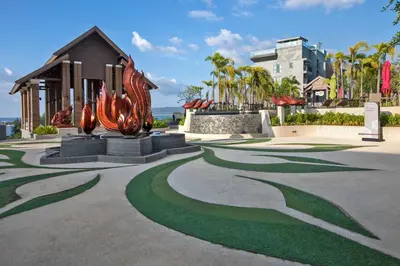 a sculpture in a park with a building in the background at 2bdr Apartment with Jacuzzi SeaView by CapitalPro 307 in Phuket Town