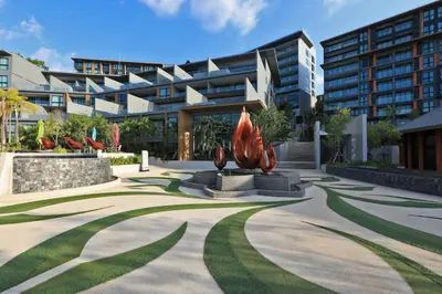 a courtyard with a statue in front of a building at 2bdr Apartment with Jacuzzi SeaView by CapitalPro 307 in Phuket Town