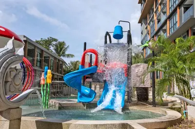a water park with a water slide in a fountain at 3bdr SeaView Apartment in Surin Beach by Capital Pro in Phuket Town