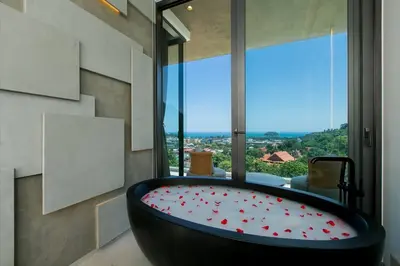 a bathroom with a large tub with red hearts on it at Villa Nordic Star Seaview Near Kata Beach in Kata Beach