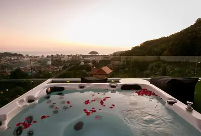 a jacuzzi tub with a view of a city at Villa Nordic Star Seaview Near Kata Beach in Kata Beach