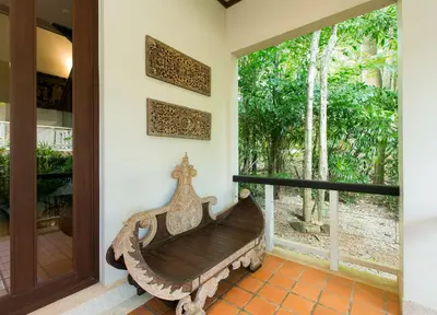 a wooden bench in a room with a window at Katamanda villa Sooksan Near Kata Noi Beach in Kata Beach
