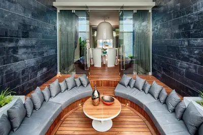 a living room with a couch and a table at Iniala Beach House in Natai Beach