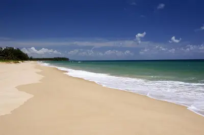 a sandy beach with the ocean in the background at Iniala Beach House in Natai Beach
