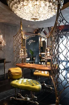 a room with a mirror and a table and stools at Iniala Beach House in Natai Beach